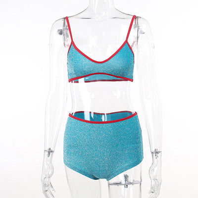 Shimmery purple two-piece swimsuit with orange trim, featuring a bralette top and high-waisted shorts. - Image 14