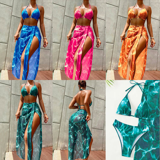 Women's pink and white tie-dye three-piece bikini swimsuit with a halter top, bottoms, and high-slit sarong.
