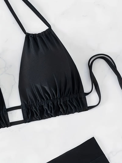 Women's black deep V push-up bikini with lace-up back and high-waisted bottom, laid flat on white marble. - Image 8