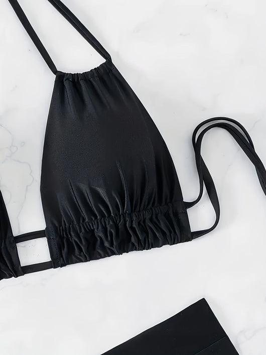 Women's black deep V push-up bikini with lace-up back and high-waisted bottom, laid flat on white marble. - Image 8