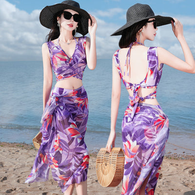 Women's light blue tropical leaf print three-piece swimsuit with short sleeve bikini top, bottoms, and sarong skirt. - Image 9