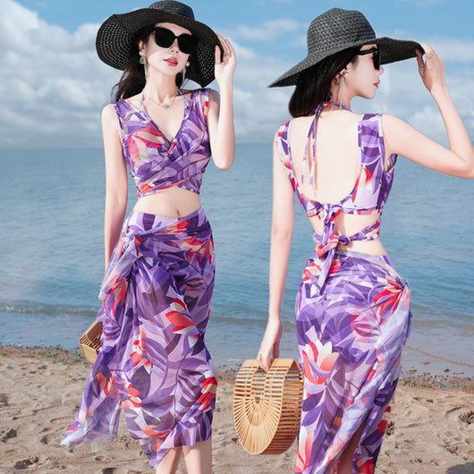 Women's light blue tropical leaf print three-piece swimsuit with short sleeve bikini top, bottoms, and sarong skirt. - Image 9