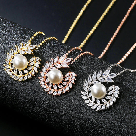 Elegant pearl and cubic zirconia jewelry set with a necklace and two earrings, featuring a wreath design. - Image 4