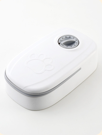 White automatic pet feeder with a pink timer dial and an embossed paw print on the lid. - Image 8