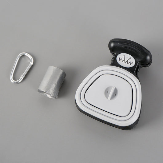 Blue and black foldable pet poop bag dispenser with an integrated scoop, ideal for travel and outdoor use.