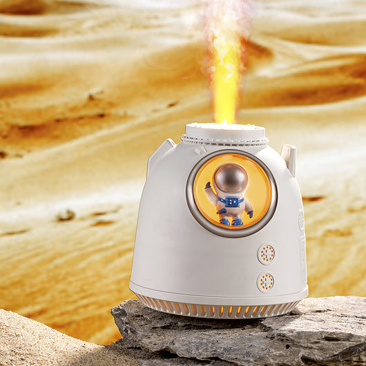 White spaceman humidifier with an orange-lit window featuring a small astronaut figure and a glowing top light. - Image 8