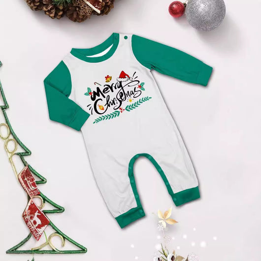 Family of four wearing matching green and white striped Christmas pajamas with "Merry Christmas" graphic. - Image 5