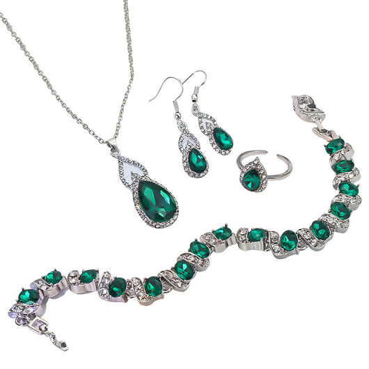 Light luxury jewelry set with silver-tone necklace, dangle earrings, open ring, and bracelet, all featuring emerald green teardrop and oval stones with clear rh - Image 5