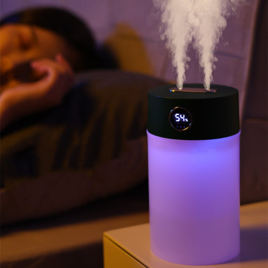 White cylindrical humidifier with a gold nozzle emitting mist, featuring a subtle bear emblem. Includes five aromatherapy oil bottles. - Image 4