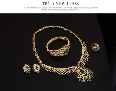 Four-piece gold-tone jewelry set with green teardrop accents and clear rhinestones, including a necklace, bracelet, earrings, and ring. - Image 5
