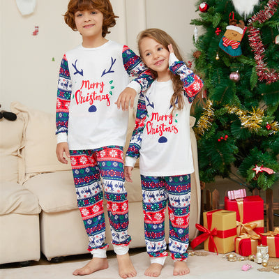 Family of four wearing matching white and red/blue Christmas pajamas with reindeer antlers and 'Merry Christmas' text. - Image 8
