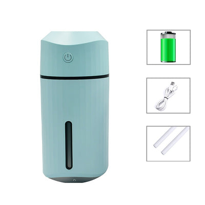 Pink portable humidifier with a power button, water level indicator, USB charging cable, and two cotton swabs. - Image 12