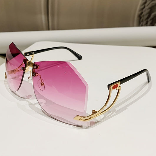 Rimless sunglasses with gradient pink lenses and gold-tone hollow temples, featuring a unique quadrilateral shape. - Image 3