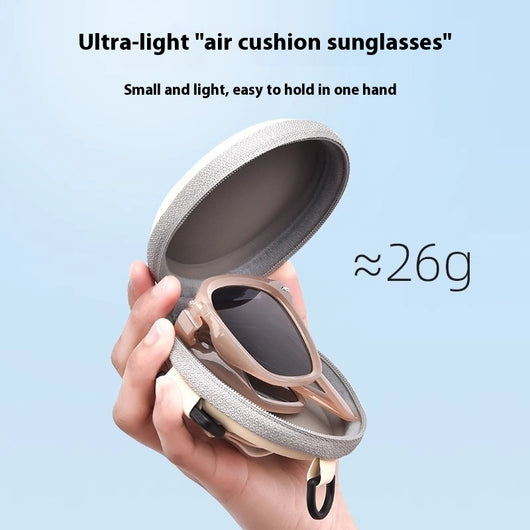 Brown oval sunglasses with dark lenses and thick frames, featuring visible silver hinges on a light gray background. - Image 3