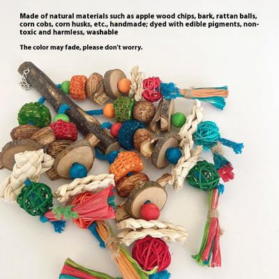 Hanging parrot toy made from natural wood, corn husk, and nuts with colorful strings and beads. A small yellow bird perches on the toy. - Image 3