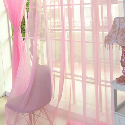 Close-up of a solid red sheer tulle curtain hanging in front of a window, allowing light to filter through. - Image 39