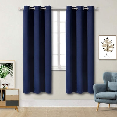 Light gray polyester blackout curtains with grommet tops hanging on a white rod in a modern living room. - Image 21