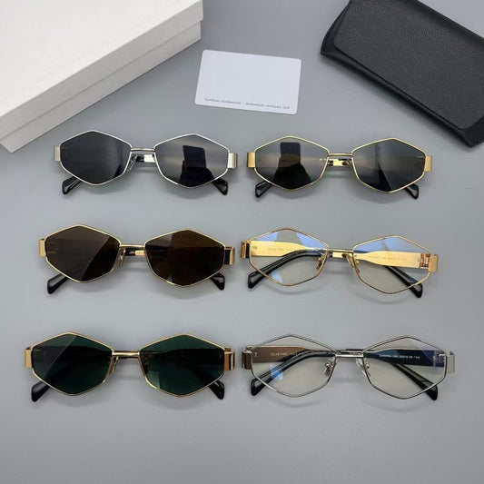 Gold metal polygon sunglasses with dark lenses, displayed with a white authenticity card and black case.