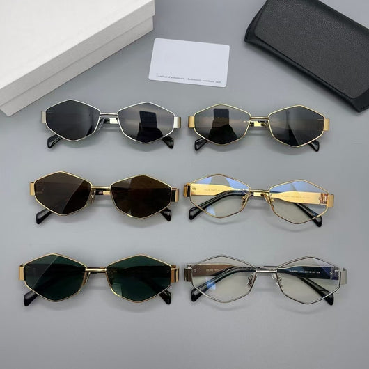 Gold metal polygon sunglasses with dark lenses, displayed with a white authenticity card and black case.