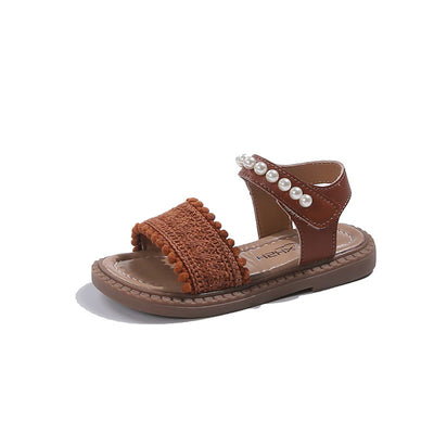 Children's white sandals with pearl ankle straps, woven front strap, and brown sole, featuring a Velcro closure. - Image 15