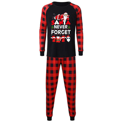 Matching family pajamas with black tops, red plaid raglan sleeves, and "SANTA NEVER FORGET 2020" graphic. Includes two adult and one child set with red plaid pa - Image 5