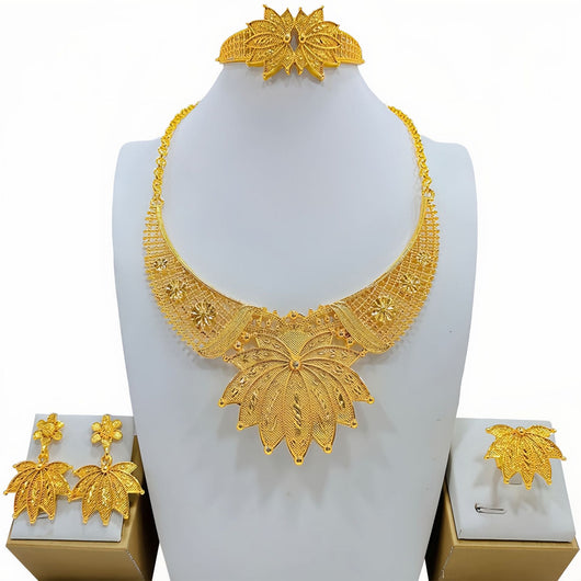 Gold-colored women's jewelry set with ornate floral and filigree designs, including a necklace, drop earrings, bracelet, and ring. - Image 7