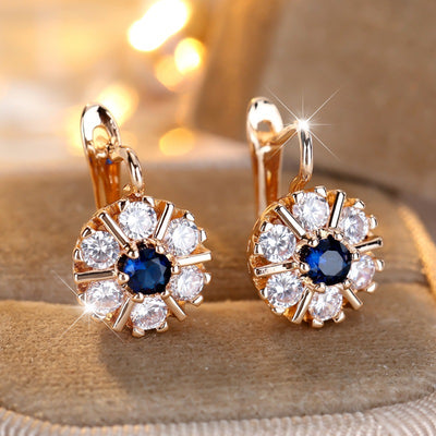Aretes Flor de Zirconia Blanca y Zafiro Azul - Image 7