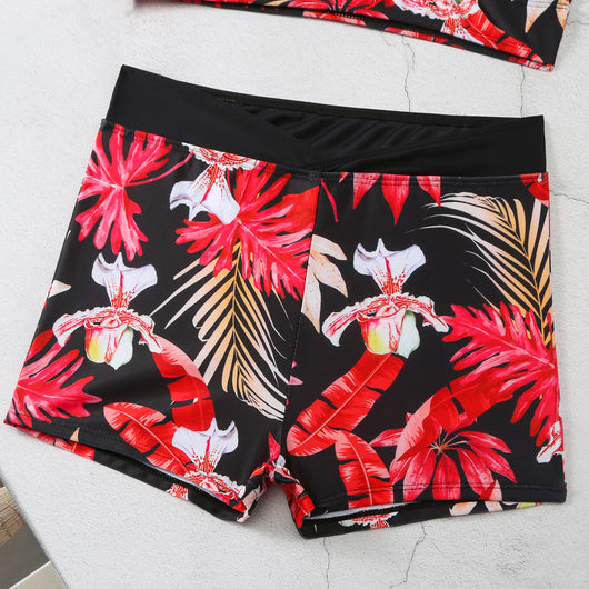 Two-piece swimsuit with a black background and vibrant pink and purple tropical floral print. Features a V-neck crop top and high-waisted boxer shorts. - Image 18