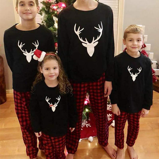 Mom's black long-sleeve pajama top with white deer head print and red and black plaid pajama pants. - Image 13