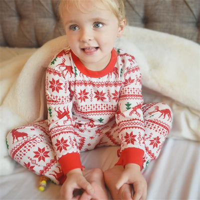 Family matching Christmas pajamas with red reindeer and snowflake print on white, including adult, kids, and baby sizes. - Image 7