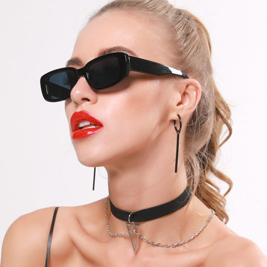 Rectangular tortoiseshell sunglasses with a small frame and dark gray lenses, angled on a white background. - Image 44
