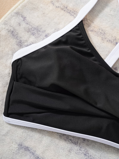 Black and white color matching bikini swimsuit with a high-waisted drawstring bottom and a split top. - Image 11