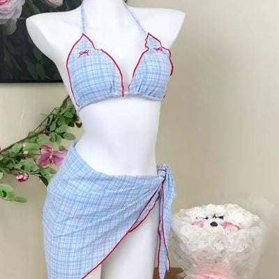 Woman in a retro plaid bikini three-piece set with a halter top, bikini bottom, and matching sarong skirt. - Image 8