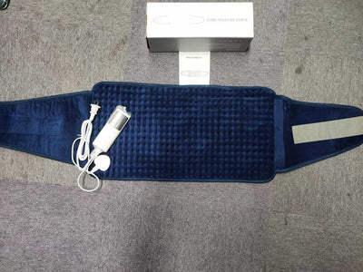 Gray quilted waist heating belt with an adjustable strap, wired remote control, and power plug, shown with its box. - Image 7