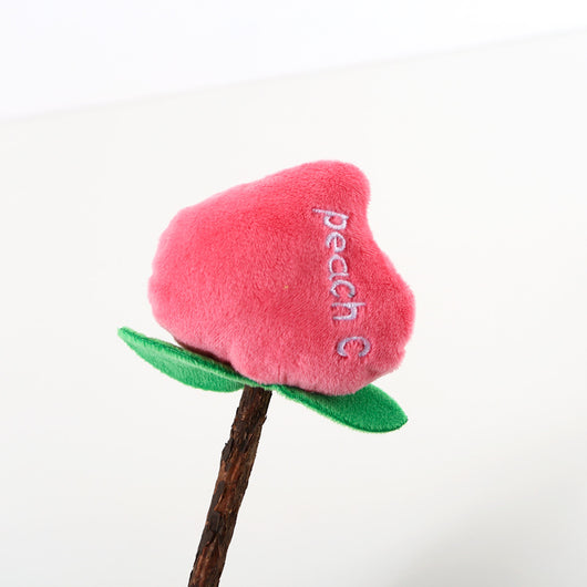 Plush carrot-shaped cat molar stick with green leaves on a natural wood stick, designed for pet play. - Image 5