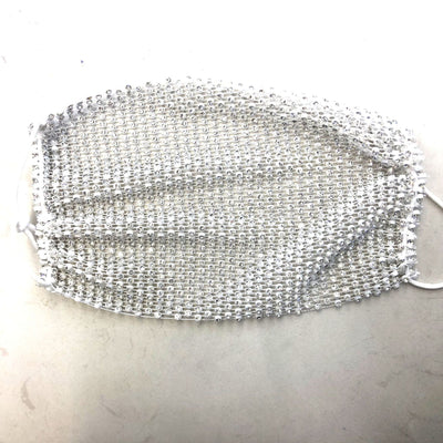 Close-up of a blue mesh fabric adorned with numerous small, clear rhinestones, creating a sparkling texture. - Image 15