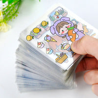 Stack of clear PET journal stickers with cartoon designs, including a character in a purple bunny suit, lemons, and desserts.