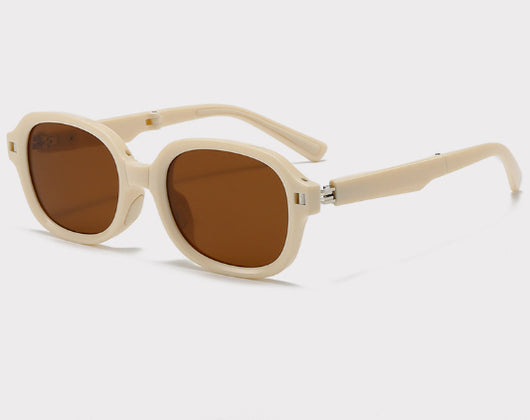 Brown oval sunglasses with dark lenses and thick frames, featuring visible silver hinges on a light gray background. - Image 9