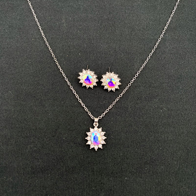 Iridescent teardrop pendant necklace with matching stud earrings, featuring clear accent stones and silver-tone metal. - Image 7