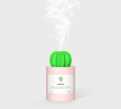 Person holding a glowing white cactus humidifier with a green top; inset shows five white humidifier filter sticks. - Image 13