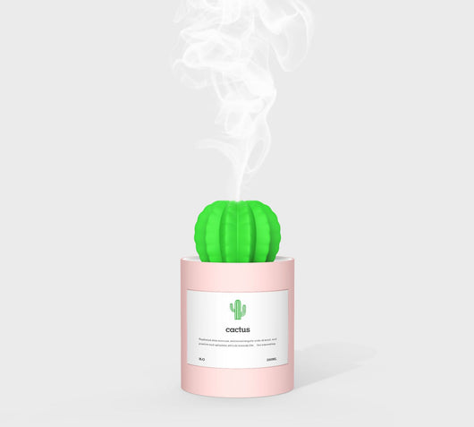 Person holding a glowing white cactus humidifier with a green top; inset shows five white humidifier filter sticks. - Image 13