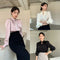 Blusa Elegante con Cuello en V y Mangas Abullonadas