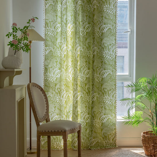 Green curtain with white leafy botanical pattern and cream tassels, hanging in a window with natural light. - Image 7