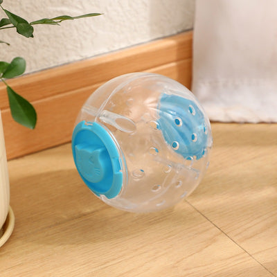 Clear plastic pet tumbler food leakage toy with blue accents and a cat face design, on a wooden floor. - Image 8