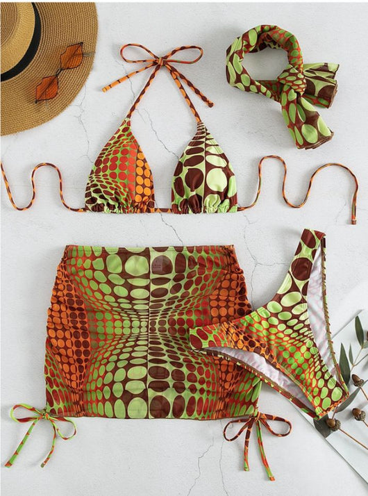 Women's printed split bikini swimsuit set with halter top, high-cut bottom, sarong skirt, and headscarf in green, brown, and orange optical dot pattern. - Image 9