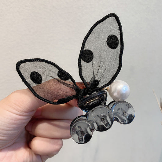 Black sheer polka dot rabbit ears hair claw clip with a faux pearl and gold-toned metal accents. - Image 3
