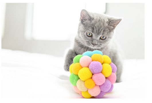 Colorful cat toy ball made of soft, pastel-colored pom-poms, including yellow, pink, purple, green, and blue. - Image 9