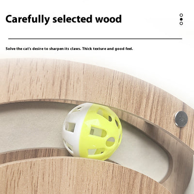 Multi-level cat scratcher with a round corrugated cardboard surface, a wooden track with a green ball, and a pink feather wand with a bell. - Image 4