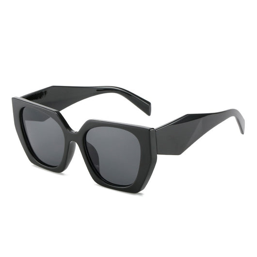 Retro cat-eye sunglasses with a vibrant orange frame, brown temples, and light champagne-colored lenses. - Image 5