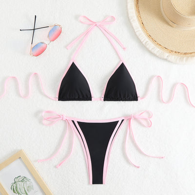 Royal blue two-piece bikini with light blue trim and tie straps, laid flat on a white textured surface. - Image 10
